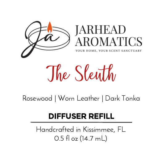 Label for The Sleuth - Cold Air Diffuser Refill by Jarhead Aromatics, with notes of rosewood, worn leather, patchouli, and dark tonka. Handcrafted in Kissimmee, FL. 0.5 fl oz (14.7 mL).