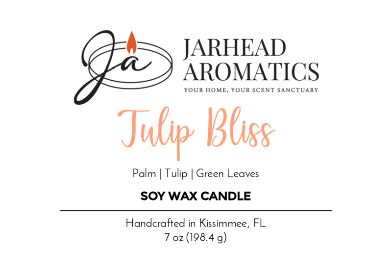 A label for Jarhead Aromatics’ Tulip Bliss - Soy Wax Candle. Scent notes: Palm, Tulip, Green Leaves, Citrus. Handcrafted in Kissimmee, FL. Net Wt 7 oz (198.4 g). Logo shows a candle flame above stylized JA.