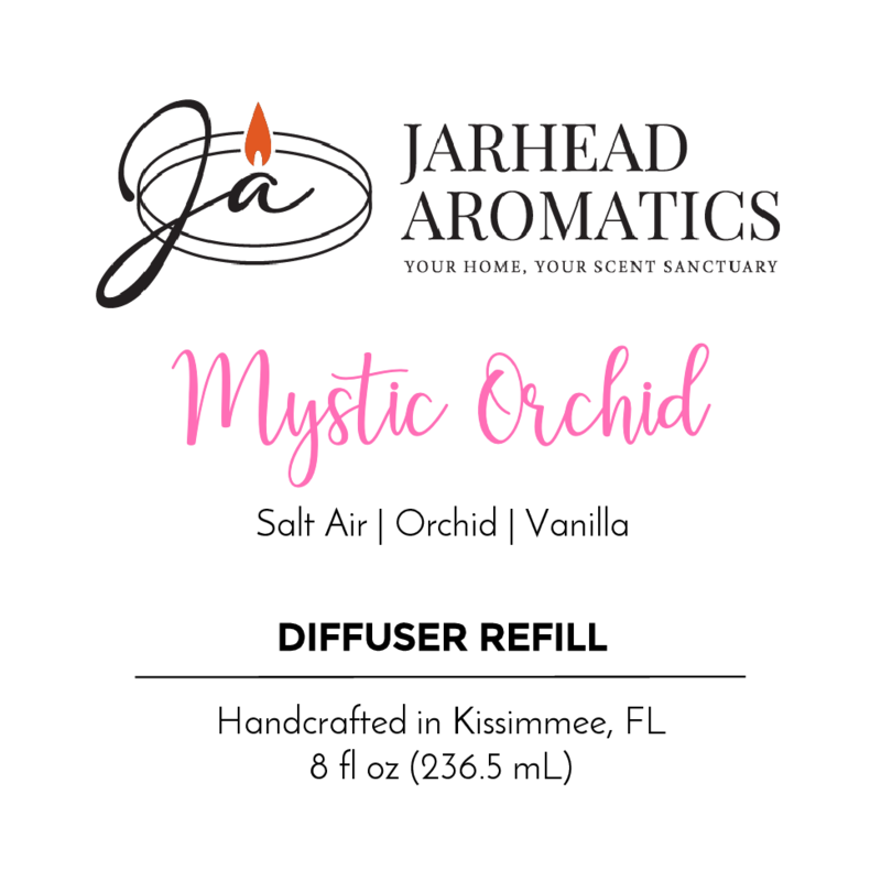 The Jarhead Aromatics Mystic Orchid - Diffuser Refill label showcases notes of coastal freshness, exotic orchid, and vanilla. Handcrafted in Kissimmee, FL. 8 fl oz (236.5 mL). Features black and pink text with a flame logo.