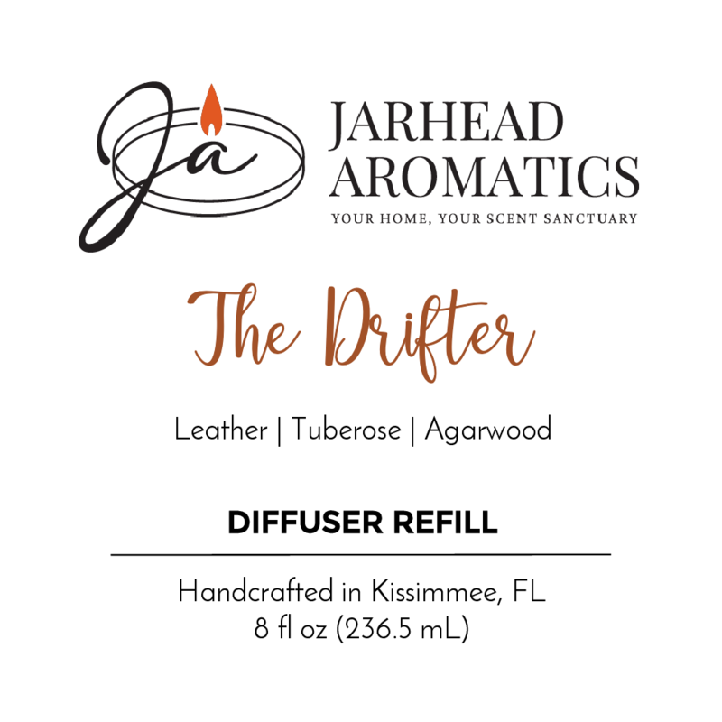 Label for Jarhead Aromatics’ The Drifter Diffuser Refill, with notes of rugged leather, tuberose, and smoky agarwood. Handcrafted in Kissimmee, FL. 8 fl oz (236.5 mL). Includes candle flame logo.