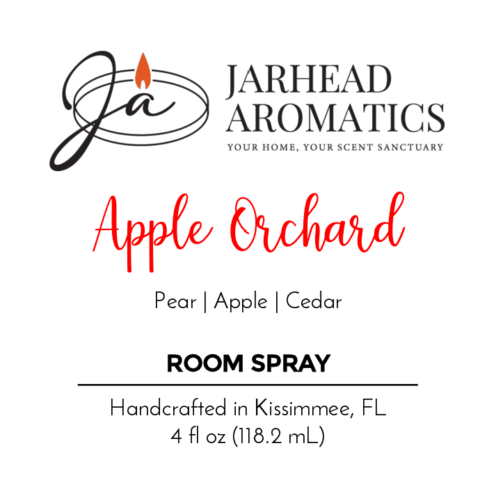 A product label for Jarhead Aromatics Apple Orchard Room Spray features pear, fresh apples, and cedar fragrance notes. It is handcrafted in Kissimmee, FL, with a 4 fl oz (118.2 mL) volume and includes the logo and tagline.