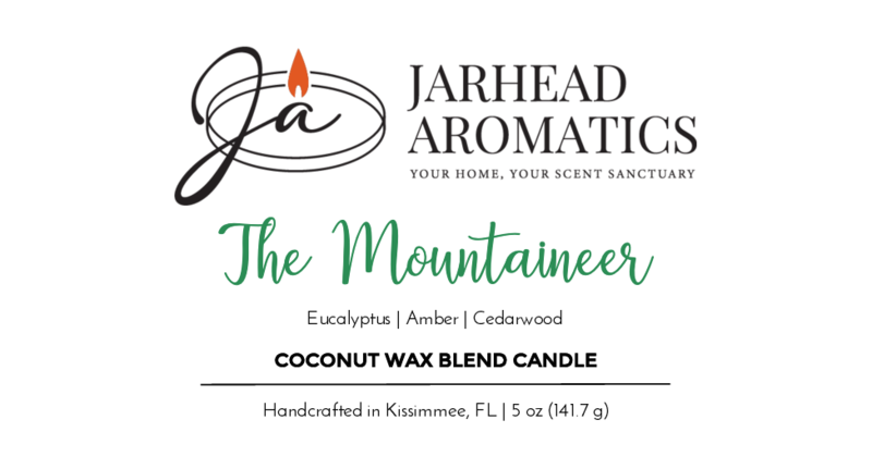 Label for The Mountaineer by Jarhead Aromatics: A 5 oz (141.7 g) coconut wax blend candle with eucalyptus, amber, cedarwood, and subtle campfire scents. Handcrafted in Kissimmee, FL.