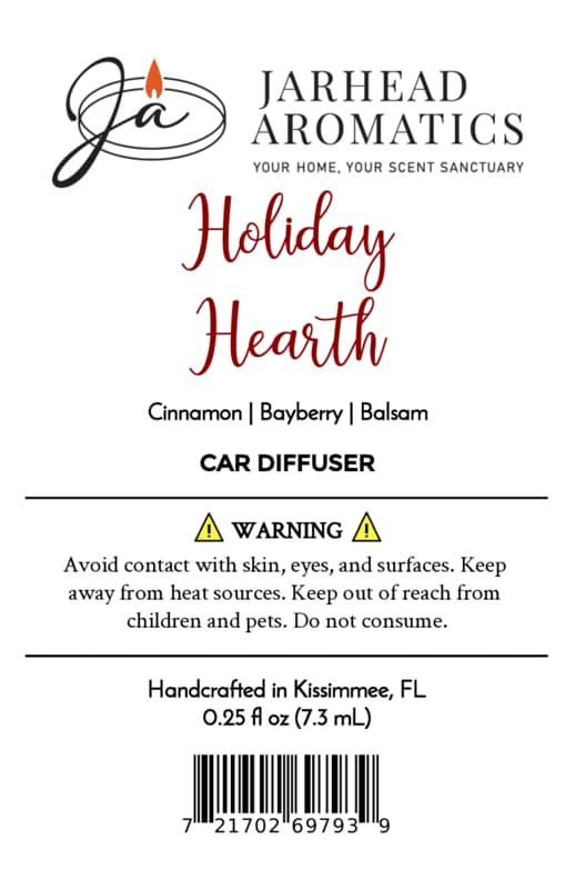 Product label for a Holiday Hearth Car Diffuser | Cinnamon, Clove & Bayberry featuring aromatic fragrance notes, safety warnings, and a barcode.
