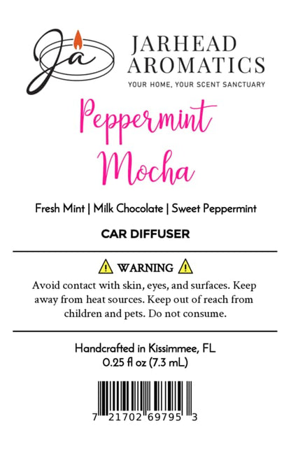 Product label for a Jarhead Aromatics Peppermint Mocha Car Diffuser listing scent notes of fresh mint, milk chocolate, and sweet peppermint, alongside safety warnings and usage information for this holiday car fragrance.