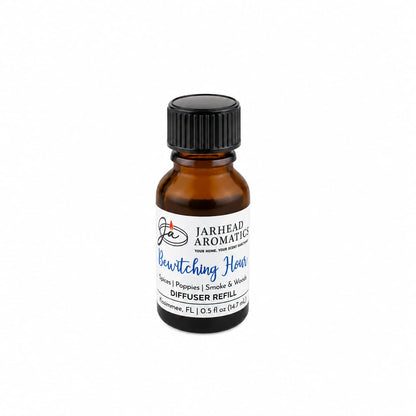 A small amber glass bottle labeled “Jarhead Aromatics Bewitching Hour Cold Air Diffuser Refill | Exotic Spices, Dark Florals & Smoky Woods,” topped with a black screw cap, is displayed against a plain white background. This gothic-inspired home fragrance oil refill by Jarhead Aromatics fills any space with an enchanting blend of exotic spices, dark florals, and smoky woods.