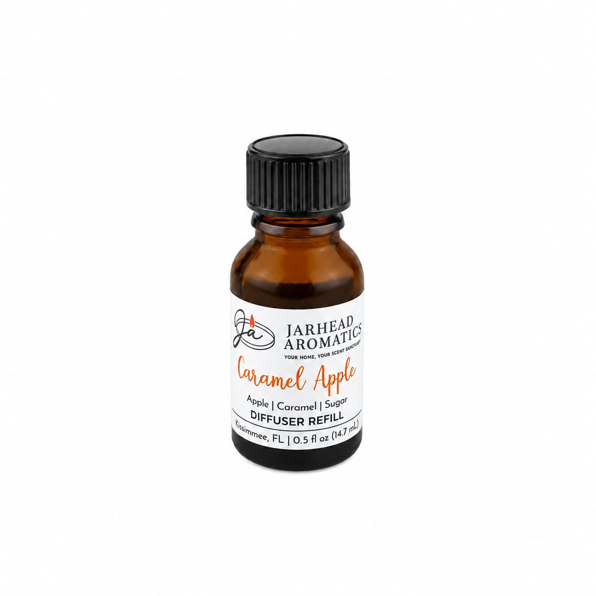 A small amber glass bottle labeled “Jarhead Aromatics Caramel Apple Cold Air Diffuser Refill | Crisp Apple, Rich Caramel & Warm Spice” with a black screw cap, placed on a white background. This home fragrance oil by Jarhead Aromatics is perfect for your cold air diffuser, filling your space with the warm and inviting scent of crisp apple, rich caramel, and warm spice.