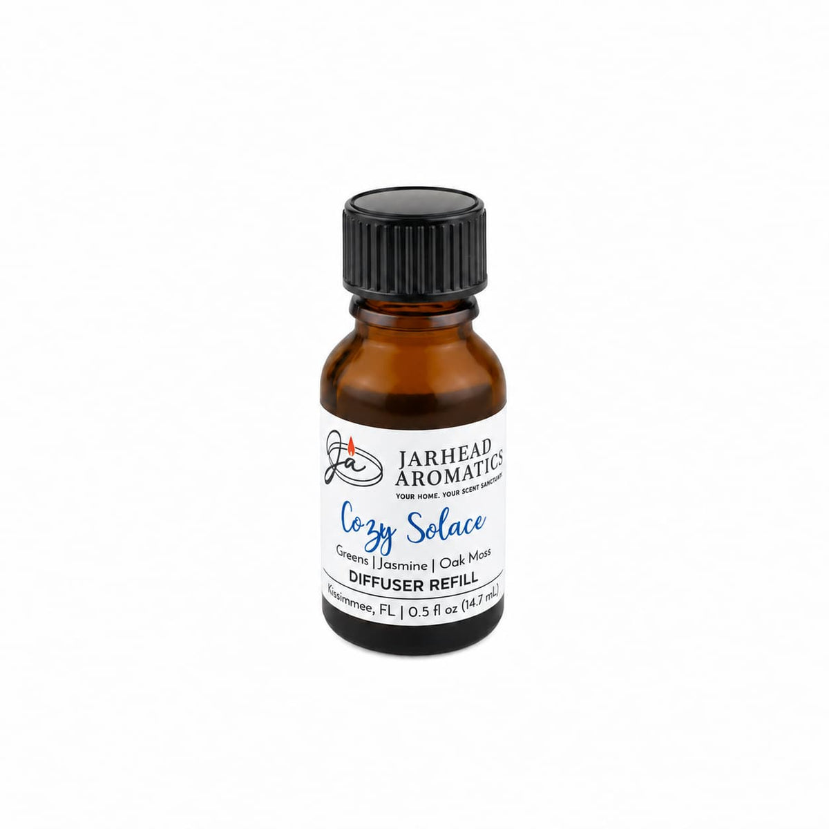 A small brown glass bottle labeled Jarhead Aromatics Cozy Solace Cold Air Diffuser Refill, featuring a home fragrance blend of fresh greens, jasmine, and oak moss—perfect as a home fragrance oil—displayed on a white background.