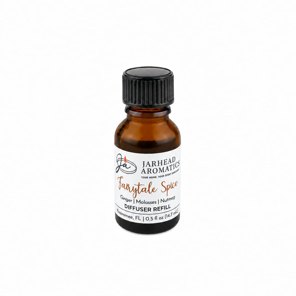 A small amber glass bottle labeled Jarhead Aromatics Fairytale Spice Cold Air Diffuser Refill features gingerbread, molasses, and warm spice scents. This holiday home fragrance is perfect for creating a cozy atmosphere and comes with a black screw cap—ideal as a cold air diffuser refill or for infusing your space with inviting gingerbread notes.