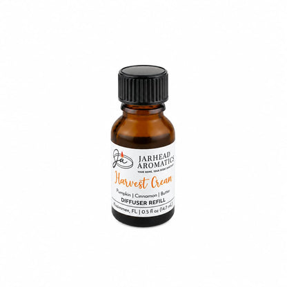A small amber bottle labeled Jarhead Aromatics Harvest Cream Cold Air Diffuser Refill sits against a plain white background, featuring cozy notes of pumpkin spice, brown sugar, and vanilla cream—perfect as a harvest cream fragrance oil or pumpkin spice diffuser refill for your cold air diffuser.