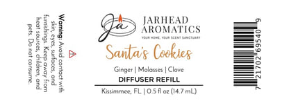 Product label for a Jarhead Aromatics Santa’s Cookies Cold Air Diffuser Refill with scent notes of ginger, brown sugar, molasses, and vanilla, including safety warnings for children and pets and a barcode on the right.