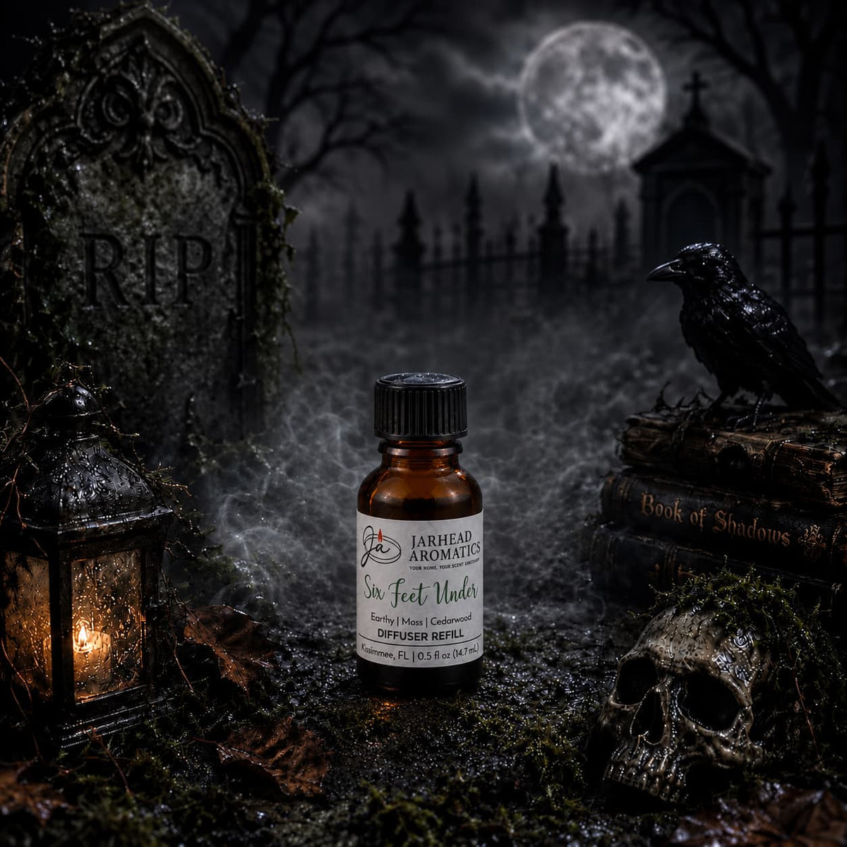 A small bottle of Jarhead Aromatics’ Six Feet Under Cold Air Diffuser Refill (featuring notes of damp earth, moss, and ancient oak) rests on mossy ground in a spooky graveyard—surrounded by a lantern, skull, raven, and tombstone—with fog and a full moon in the background; an eerie Halloween scent perfect for earthy home fragrance or as a cold air diffuser refill.
