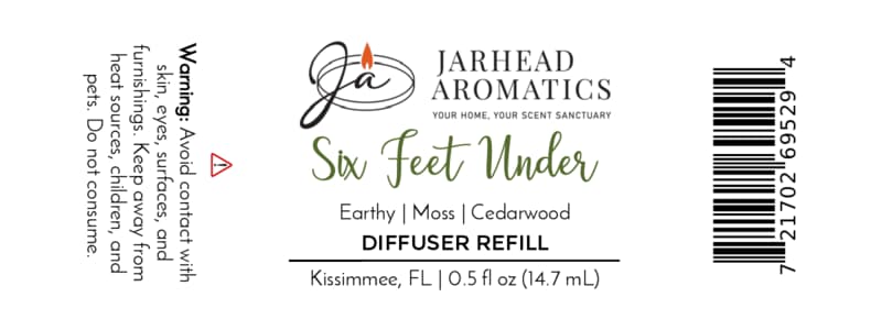 White label for Jarhead Aromatics Six Feet Under Cold Air Diffuser Refill | Damp Earth, Moss & Ancient Oak. This earthy home fragrance combines notes of damp earth, moss, and ancient oak to create the perfect Halloween scent for any space. Includes warning text, barcode, and product size: 0.5 fl oz (14.7 mL).