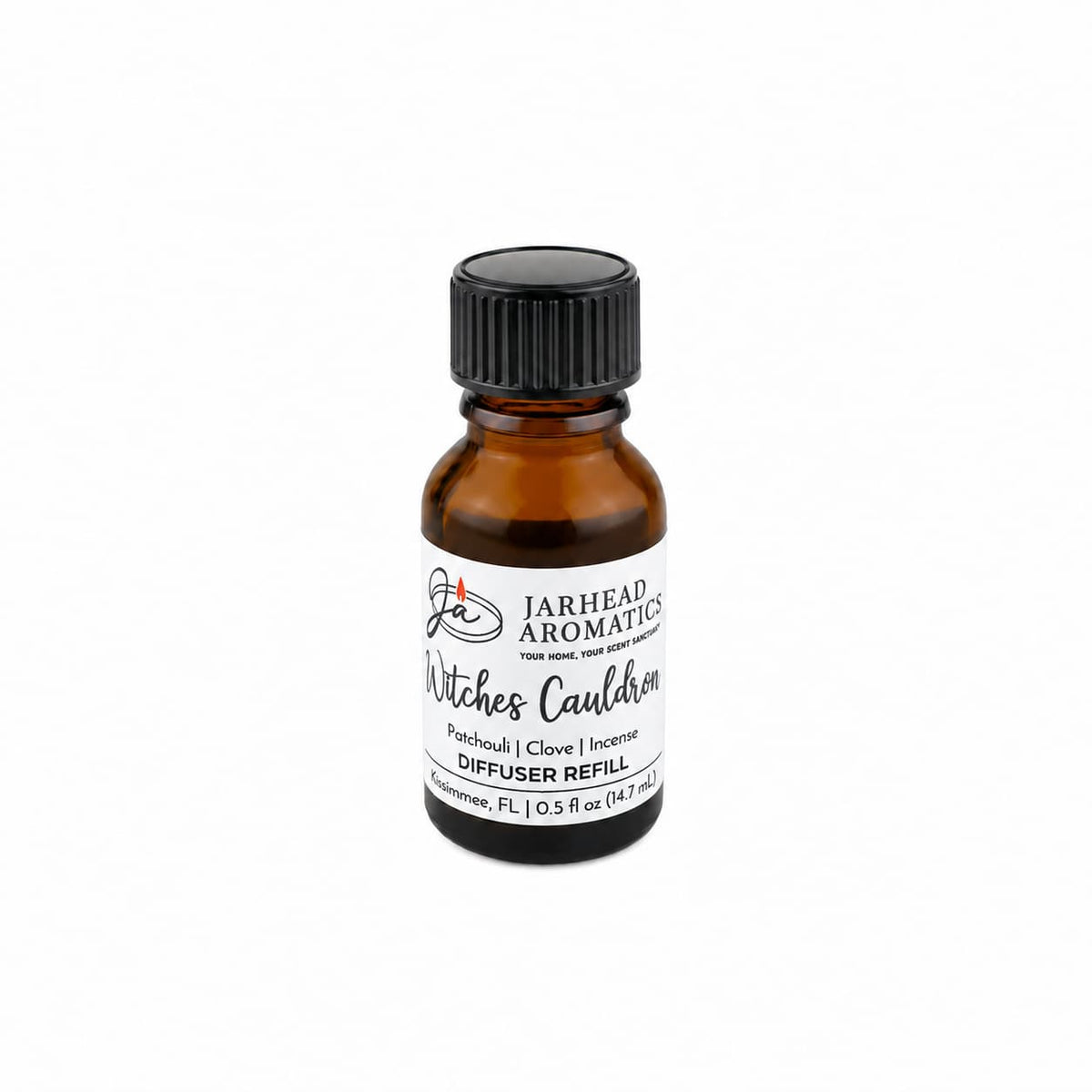 An amber glass bottle labeled “Witches Cauldron Cold Air Diffuser Refill | Orange Blossom, Patchouli & Dark Incense” by Jarhead Aromatics, featuring a Halloween-inspired fragrance blend, is displayed against a white background.