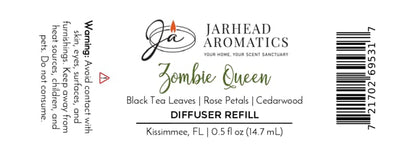 Label for Jarhead Aromatics Zombie Queen Cold Air Diffuser Refill—a gothic home fragrance with notes of black tea, rose petals, and cedarwood. This Halloween-inspired fragrance oil includes usage warnings and company contact information.
