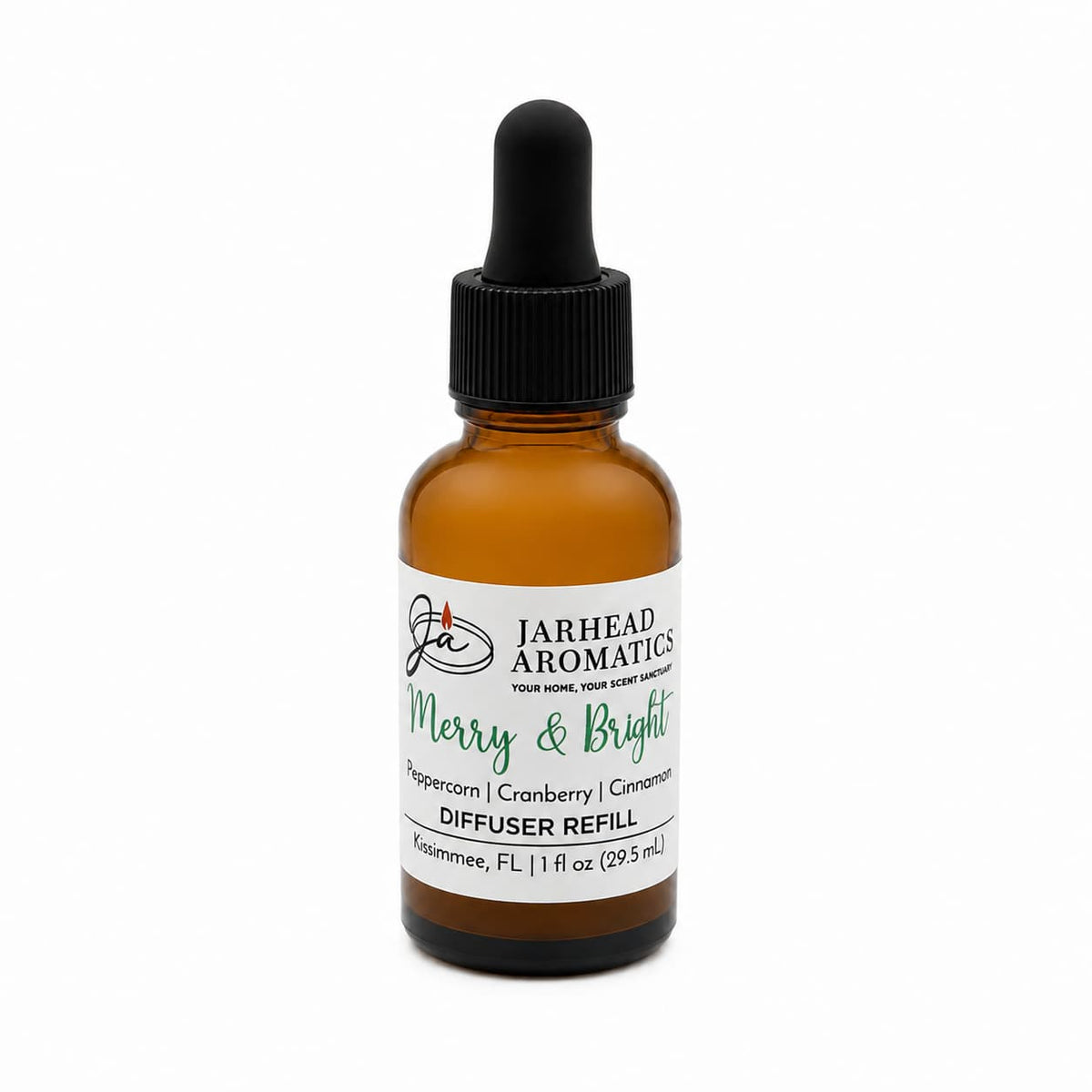 Amber glass dropper bottle of Merry & Bright Car Diffuser Refill, featuring a label with the scent notes of Peppercorn, Cranberry, and Cinnamon.