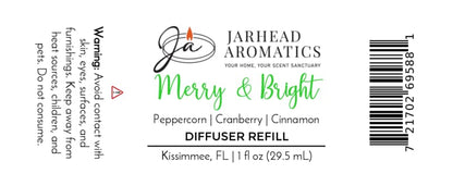 Product label for a Merry & Bright Car Diffuser Refill by Jarhead Aromatics, listing scent notes of peppercorn, cranberry, and cinnamon, with a warning to avoid contact with skin and eyes.