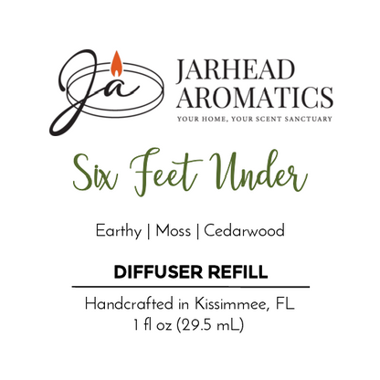 Jarhead Aromatics Six Feet Under - Car Diffuser Refill (Halloween Collection): Cemetery-inspired scent with earthy moss and cedarwood. Handcrafted in Kissimmee, FL. Size: 1 fl oz (29.5 mL). Logo features stylized Ja and flame.