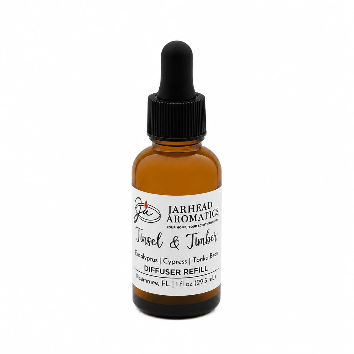 Amber glass dropper bottle of Tinsel & Timber Car Diffuser Refill, a Christmas tree fragrance with notes of eucalyptus, cypress, and tonka bean.