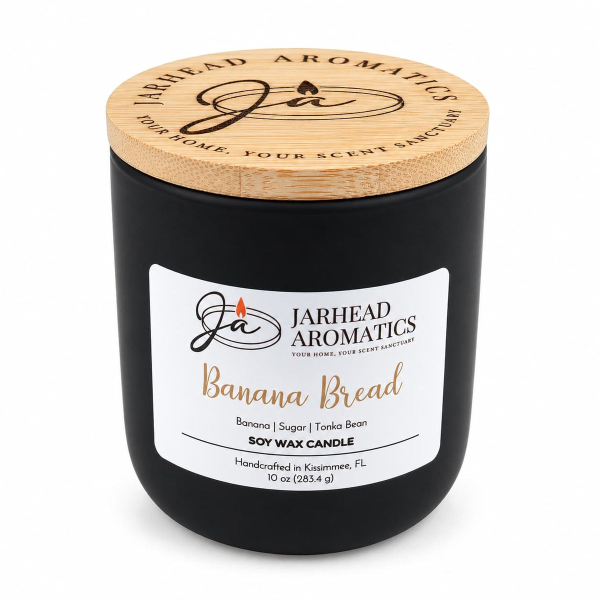 Banana Bread Soy Wax Candle | Banana, Sugar & Tonka Bean in a black glass jar with a wooden lid and a label featuring the scent notes.