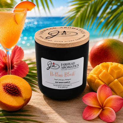 The Bellini Blast Soy Wax Candle by Jarhead Aromatics fills the air with peach, mango, and tangerine, evoking sunny beaches and tropical drinks—a refreshing fruit-scented escape in every jar.