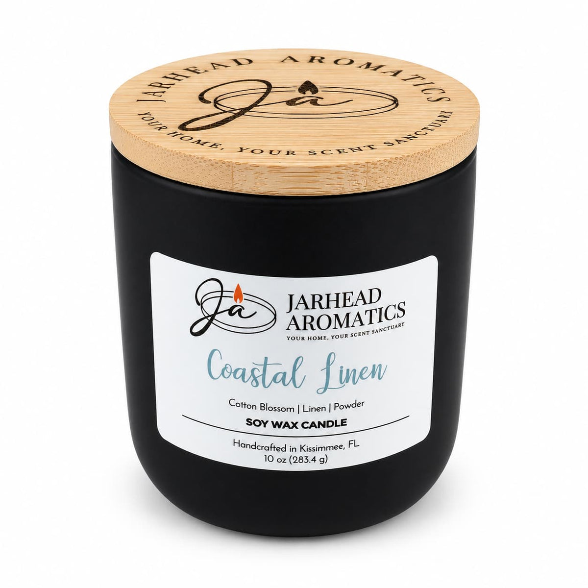 A matte black Jarhead Aromatics Coastal Linen Soy Wax Candle | Cotton Blossom, Linen & Powder featuring a light wood lid and a white label.