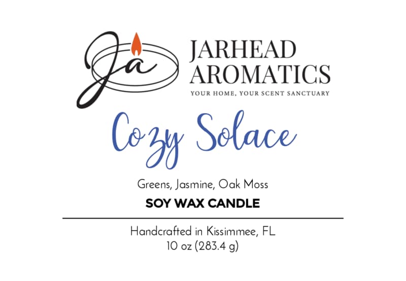 A Jarhead Aromatics hand-poured soy wax candle label for Cozy Solace, blending fresh greens, jasmine, oak moss, and musk in a comforting fall fragrance. This 10 oz (283.4 g) candle is handcrafted in Kissimmee, FL.