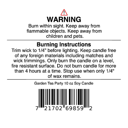 Label for our hand-poured Jarhead Aromatics Garden Tea Party Soy Wax Candle | Rose, Jasmine & Green Floral Candle, featuring warning and burning instructions, a barcode, and advice to keep away from children, pets, and flammable objects. Remember to trim the wick before lighting. Experience the delicate aroma of rose, jasmine, and green floral notes while enjoying a safer burn.