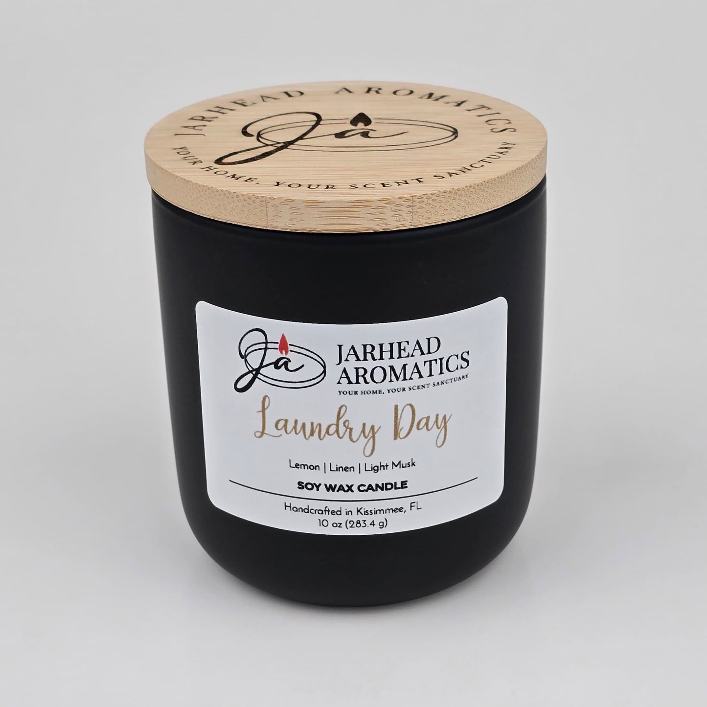 Experience the revitalizing aroma of Jarhead Aromatics’ Laundry Day Soy Wax Candle, featuring fresh linen, lemon, and light musk scent notes. Housed in a sleek black jar with a wooden lid, this 10 oz (283.5 g) candle fills your space with the clean fragrance of freshly washed linens. Handcrafted in Kissimmee, FL, it delivers a long-lasting scent that brightens any room.