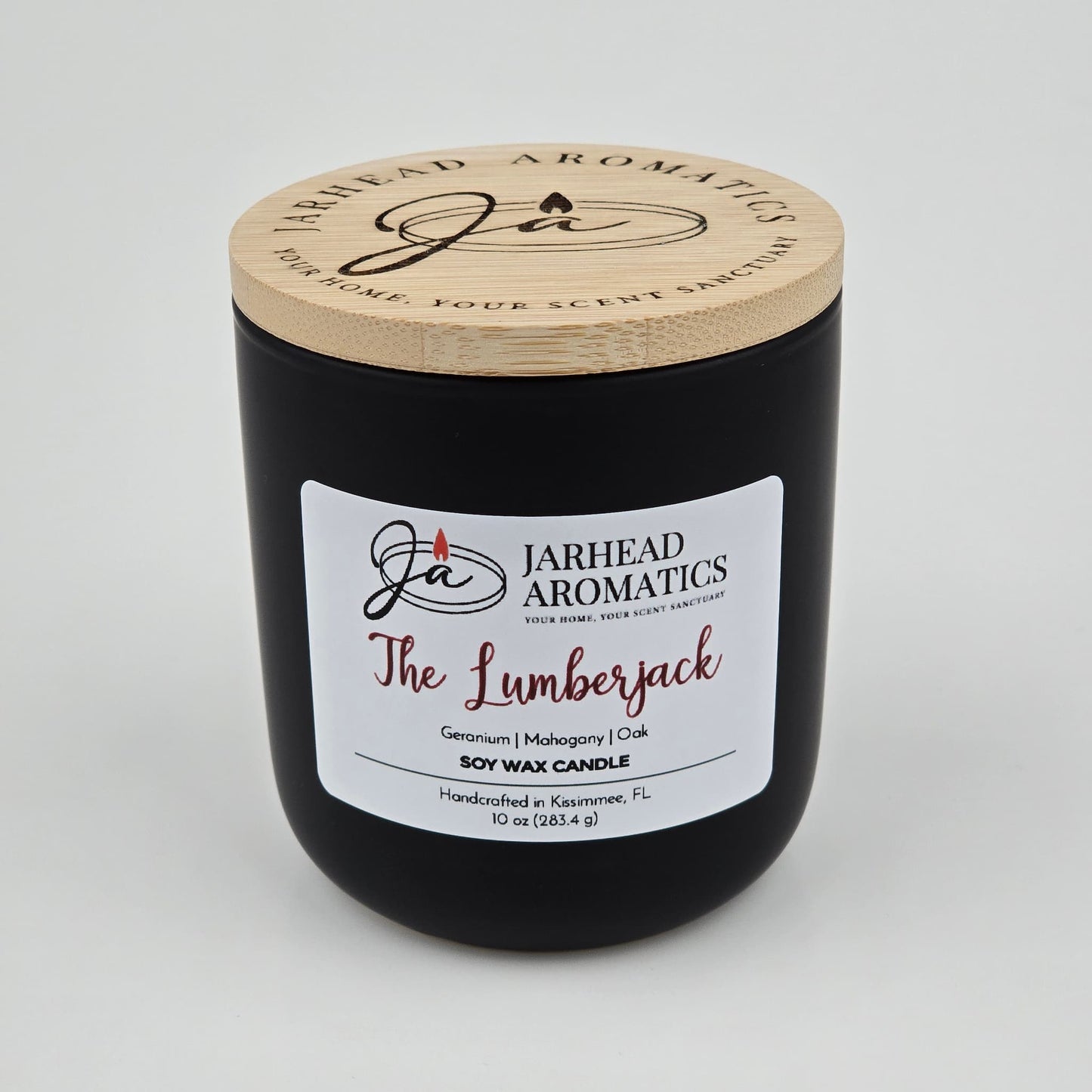 The Lumberjack Soy Wax Candle by Jarhead Aromatics comes in a black jar with wooden lid and offers cedar, oak, and mahogany scents. Handcrafted in Kissimmee, FL. 10 oz (284.5 g).