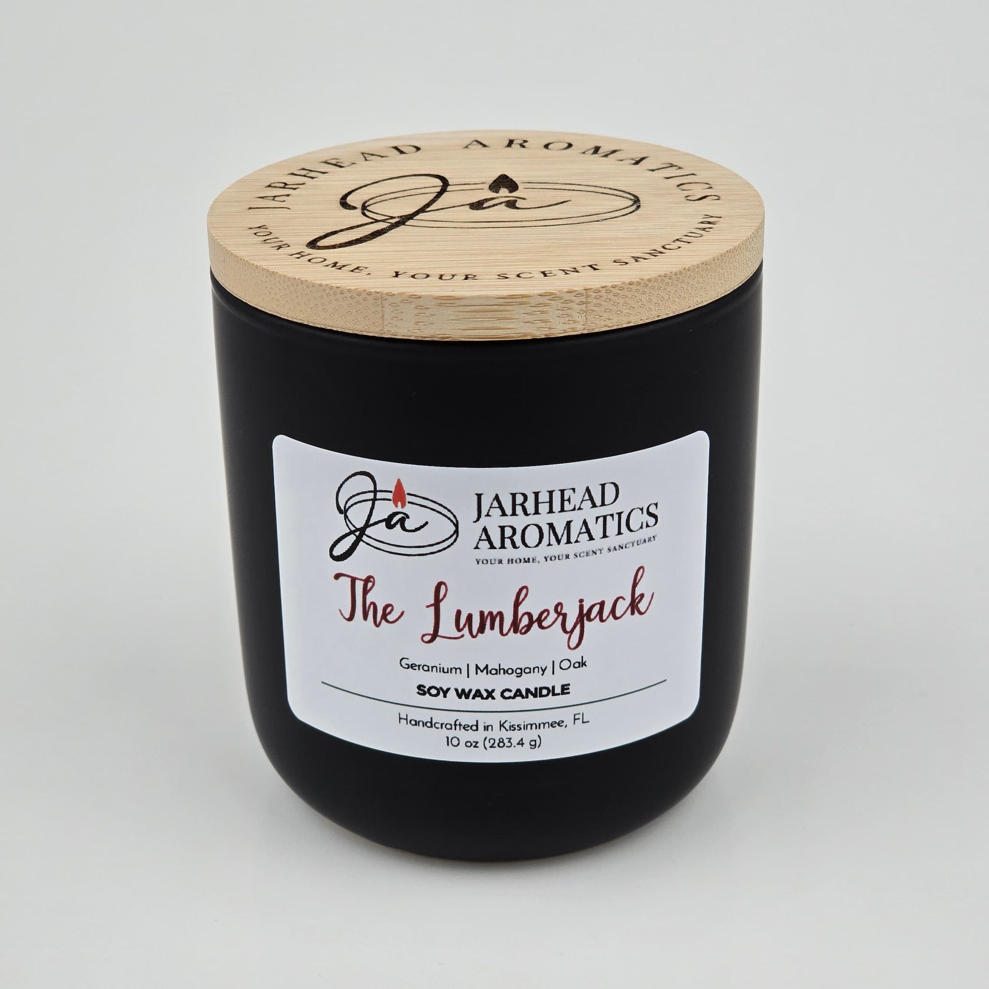 The Lumberjack Soy Wax Candle by Jarhead Aromatics comes in a black jar with wooden lid and offers cedar, oak, and mahogany scents. Handcrafted in Kissimmee, FL. 10 oz (284.5 g).