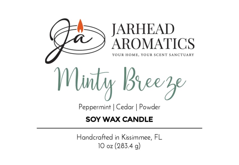 Product label for a Minty Breeze Soy Wax Candle | Peppermint, Cedar & Powder by Jarhead Aromatics, featuring aromatherapy notes of peppermint, cedar, and powder.
