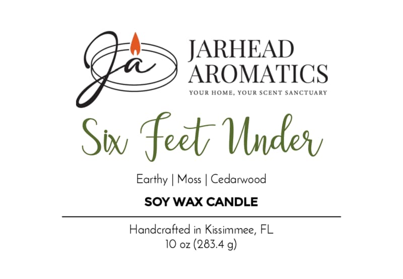 Label for the Six Feet Under Soy Wax Candle by Jarhead Aromatics, featuring earthy moss, damp soil, and cedarwood notes that capture an authentic cemetery atmosphere. Handcrafted in Kissimmee, FL; net weight 10 oz (283.4 g). Perfect as a spooky Halloween candle.