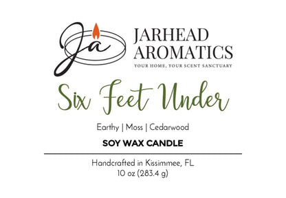 Label for the Six Feet Under Soy Wax Candle by Jarhead Aromatics, featuring earthy moss, damp soil, and cedarwood notes that capture an authentic cemetery atmosphere. Handcrafted in Kissimmee, FL; net weight 10 oz (283.4 g). Perfect as a spooky Halloween candle.