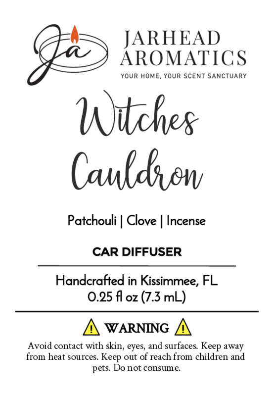 A Jarhead Aromatics label for Witches Cauldron Car Diffuser (Halloween Collection), featuring patchouli, clove, and incense oils. Includes safety warnings, instructions, and notes its handcrafted in Kissimmee, FL.