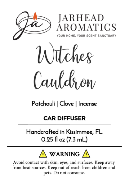 A Jarhead Aromatics label for Witches Cauldron Car Diffuser (Halloween Collection), featuring patchouli, clove, and incense oils. Includes safety warnings, instructions, and notes its handcrafted in Kissimmee, FL.