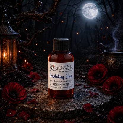 A bottle of Jarhead Aromatics’ Bewitching Hour Diffuser Refill—featuring exotic spices, dark florals, and smoky woods—rests among red flowers, a lantern, and a cauldron, with misty trees and a full moon in the background, evoking gothic elegance and making it the perfect way to elevate your home fragrance or refresh your diffuser.