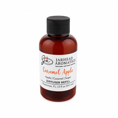 A brown bottle labeled Jarhead Aromatics Caramel Apple Diffuser Refill fills your space with the inviting scent of crisp apple, rich caramel, and warm spice—a cozy autumn fragrance. This home fragrance bottle contains 2 fl oz (59.1 mL).