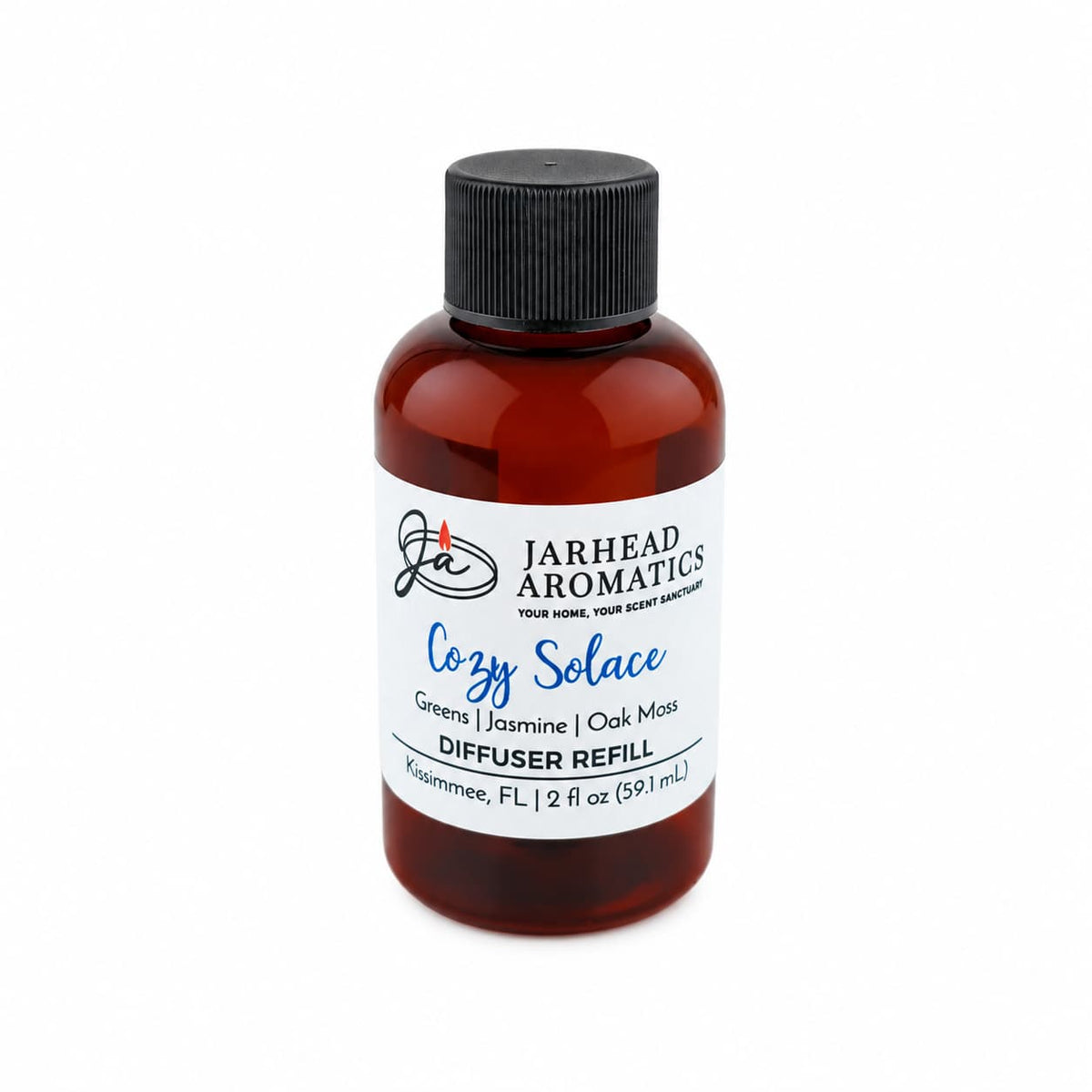A brown bottle labeled Jarhead Aromatics Cozy Solace Diffuser Refill contains 2 fl oz (59.1 mL) of an autumn-inspired fragrance blend featuring fresh greens, jasmine, and oak moss notes. Complete with a black screw cap, this refill is perfect for use in your favorite home fragrance diffuser.