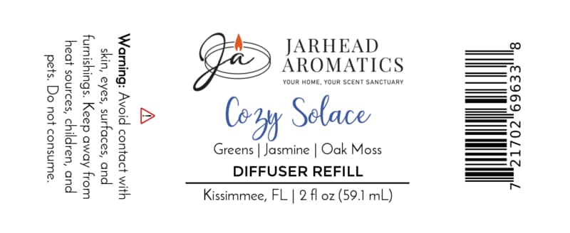 Jarhead Aromatics Cozy Solace Diffuser Refill | Fresh Greens, Jasmine, Oak Moss label includes a usage warning, ingredient notes (fresh greens, jasmine, oak moss), company logo, barcode, and bottle size (2 fl oz / 59.1 mL). Crafted in Kissimmee, FL, this autumn home fragrance is perfect for your favorite home fragrance diffuser.