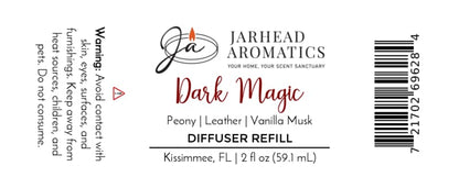 Label for Dark Magic Diffuser Refill by Jarhead Aromatics, highlighting an enchanting blend of peach, plum, dark florals, and vanilla musk. This home fragrance product includes a warning, 2 fl oz size, Kissimmee, FL location, and a barcode on the right.