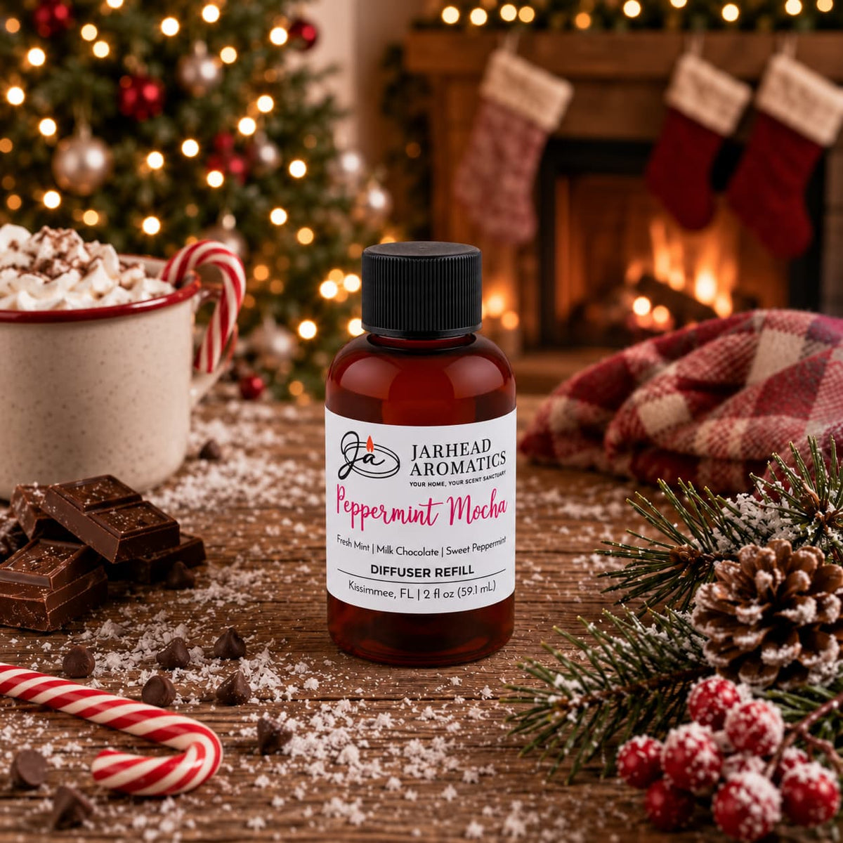 A bottle of Peppermint Mocha Diffuser Refill | Chocolate Mint & Vanilla by Jarhead Aromatics on a wooden table with chocolate, a candy cane, and a mug of hot cocoa, set against a Christmas tree and fireplace.