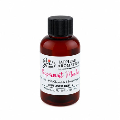 Amber glass bottle of Jarhead Aromatics Peppermint Mocha Diffuser Refill with a black cap and a white label.