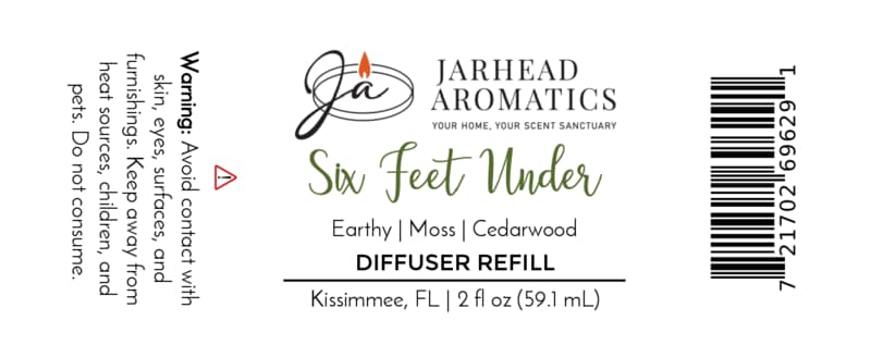 Label for Jarhead Aromatics Six Feet Under Diffuser Refill | Damp Earth, Moss & Ancient Oak, a home fragrance featuring scent notes of moss and ancient oak. Warning: Avoid contact with skin and surfaces. Size: 2 fl oz (59.1 mL). Barcode on right.