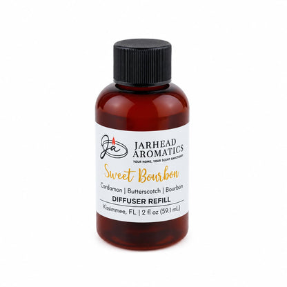 A 2 fl oz (59.1 mL) brown bottle with a black cap, labeled Jarhead Aromatics Sweet Bourbon Diffuser Refill | Bourbon, Butterscotch & Brown Sugar, is perfect for enhancing your home fragrance with inviting notes of bourbon, butterscotch, and brown sugar reminiscent of a cozy bourbon lounge.