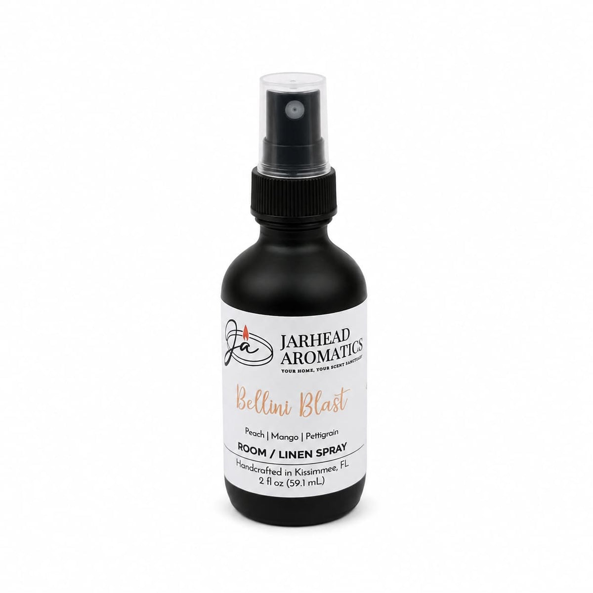 A sleek black spray bottle labeled Jarhead Aromatics Bellini Blast Room & Linen Spray delivers a vibrant tropical fragrance featuring peach, mango, and tangerine notes. Handcrafted in Kissimmee, FL, this 2 fl oz bottle is ideal for refreshing any room or linens.
