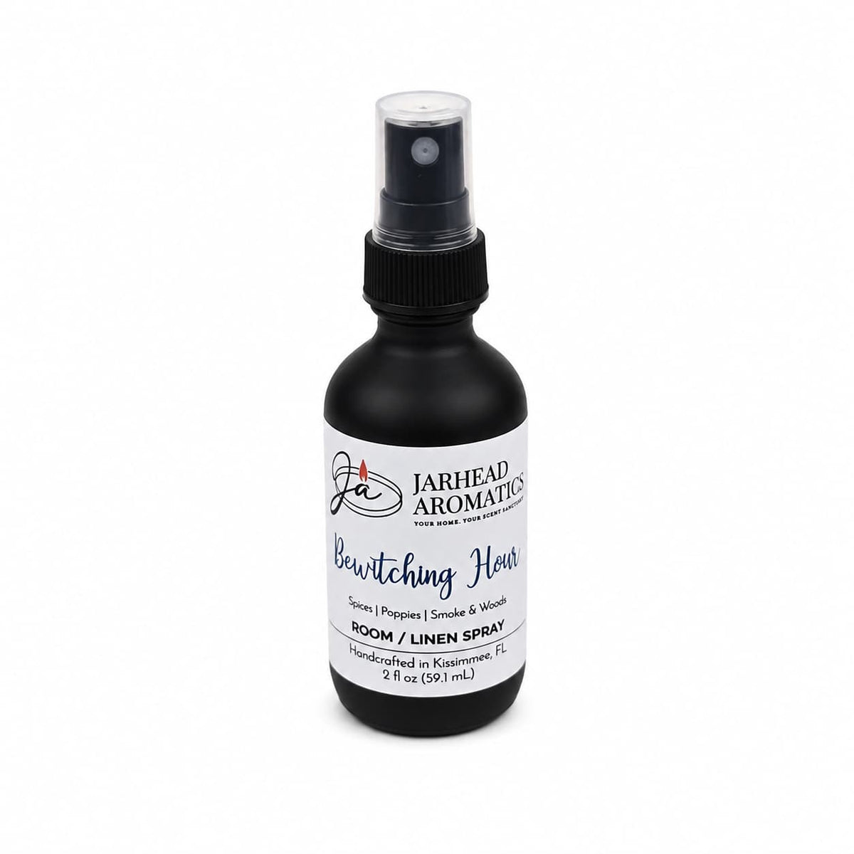 A 2 oz black spray bottle of Jarhead Aromatics Bewitching Hour Room & Linen Spray, showcasing an enchanting blend of exotic spices, dark florals, and smoky woods; the product is displayed against a white background.