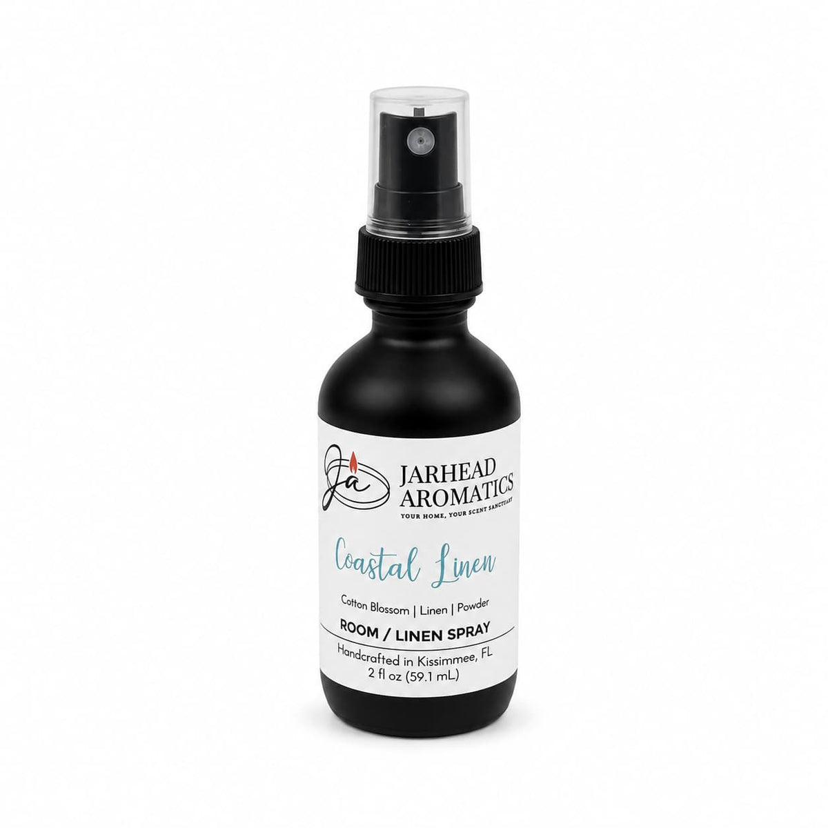 A black spray bottle labeled Jarhead Aromatics Coastal Linen Room & Linen Spray, featuring fresh linen, ozone, and sandalwood scents. This handcrafted room and linen spray delivers a refreshing home fragrance experience with every spritz. The 2 fl oz bottle is carefully made in Kissimmee, FL.