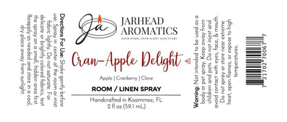 Label for Cran-Apple Delight Room & Linen Spray | Cranberry, Apple & Warm Cinnamon by Jarhead Aromatics. Immerse your space in a cozy blend of cranberry, apple, and warm cinnamon—an inviting fragrance any home will love. Ingredients: cranberry, apple, cinnamon. Directions: Shake well before use. Spray onto linens or into the air as desired. Warnings: For external use only; avoid contact with eyes—keep out of reach of children.