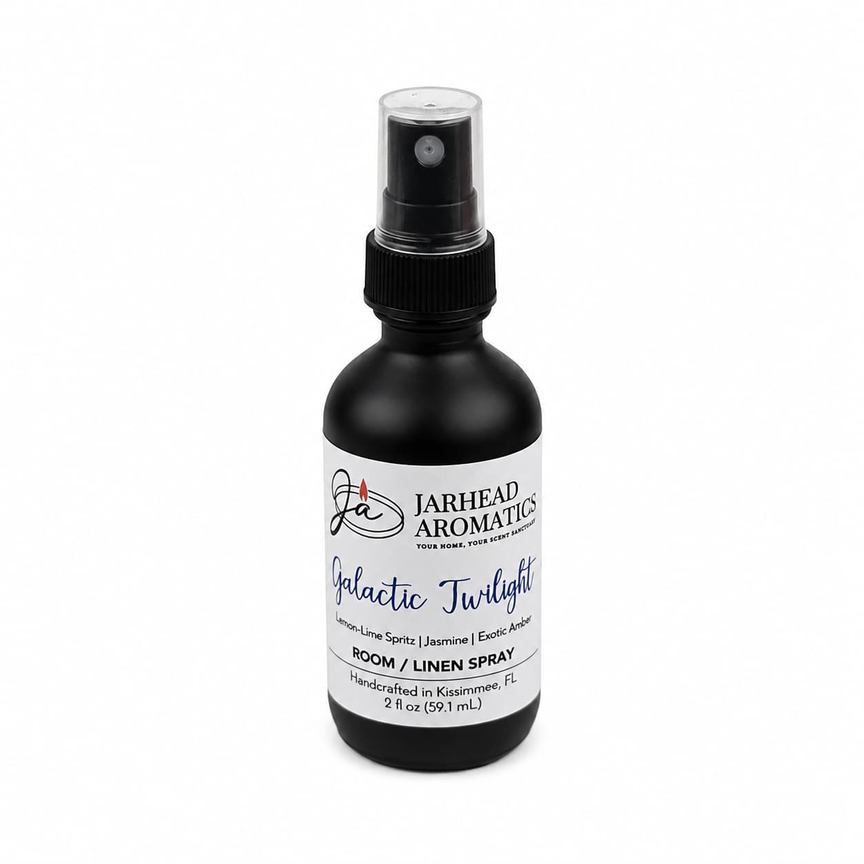 A black spray bottle labeled Jarhead Aromatics Galactic Twilight Room & Linen Spray delivers a luxurious home fragrance experience with notes of bergamot, amber, and sandalwood. The 2 fl oz bottle is handcrafted in Kissimmee, FL.