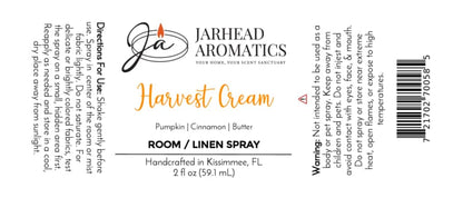 Sure! Here is the rewritten sentence using your product data: A label for Jarhead Aromatics Harvest Cream Room & Linen Spray, showcasing a luscious blend of pumpkin spice, brown sugar, and vanilla cream for an irresistible gourmand home fragrance. This versatile spray can be used as both a linen refresher and a pumpkin spice room spray—perfect for adding cozy warmth to any space. Includes directions, warnings, and manufacturer information. Handcrafted in Kissimmee, FL. 2 fl oz.